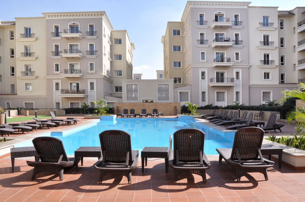 outdoor pool accommodation in Cairo Mivida by Axxodia apartment rentals New Cairo