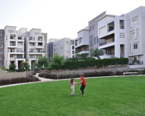 kids playing outdoors at cairo festival city living rentals by axxodia